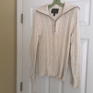 Cream cableknit sweater with zipper that can also be a turtleneck